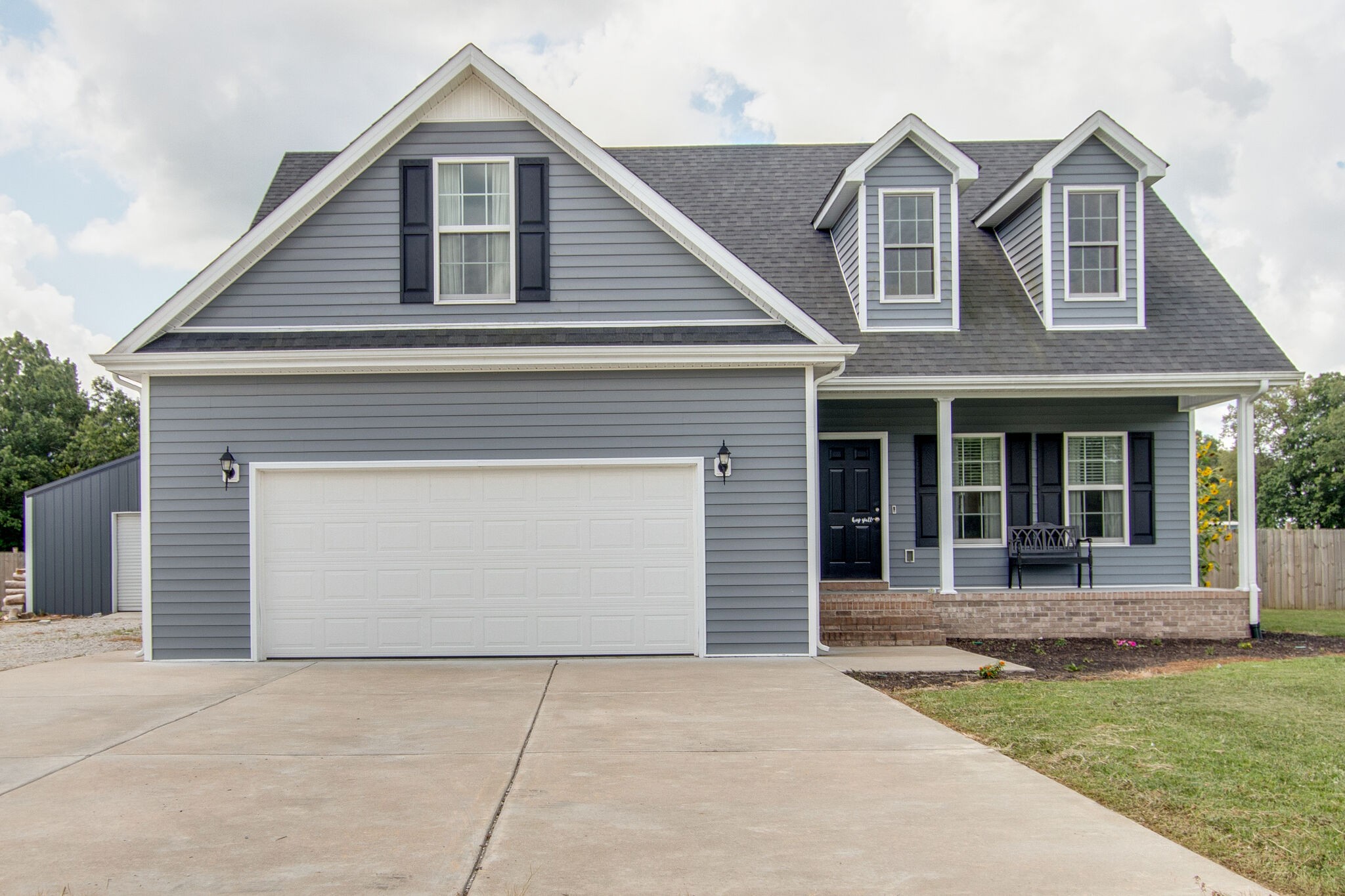 84 Houston Bell Road Manchester, TN 37355 - Photo 2 of 36 a front view of a house with garden
