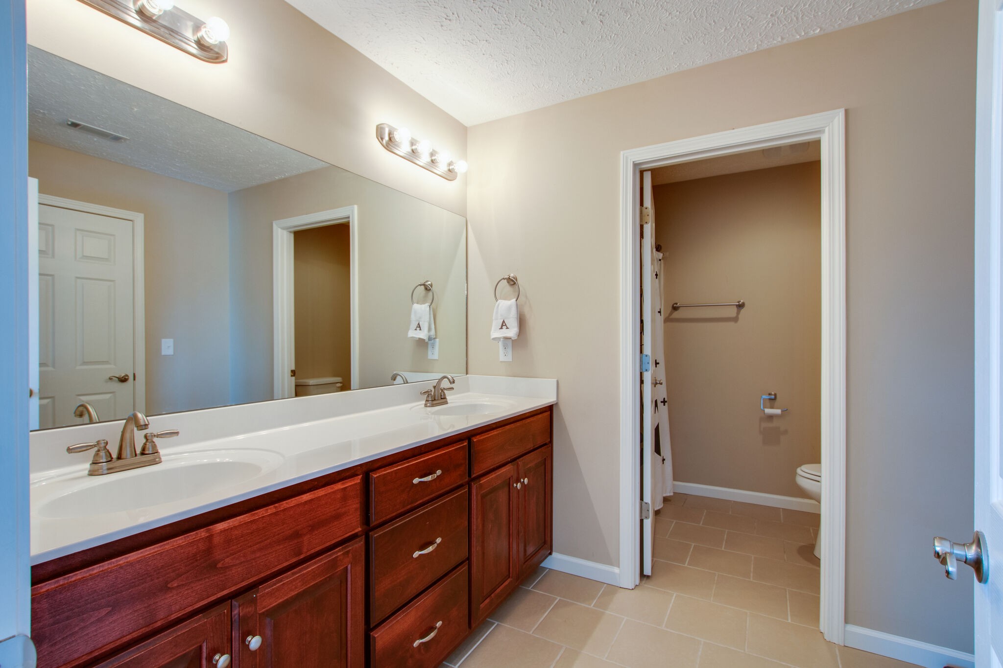 84 Houston Bell Road Manchester, TN 37355 - Photo 24 of 36 a spacious bathroom with a double vanity sink double and mirror