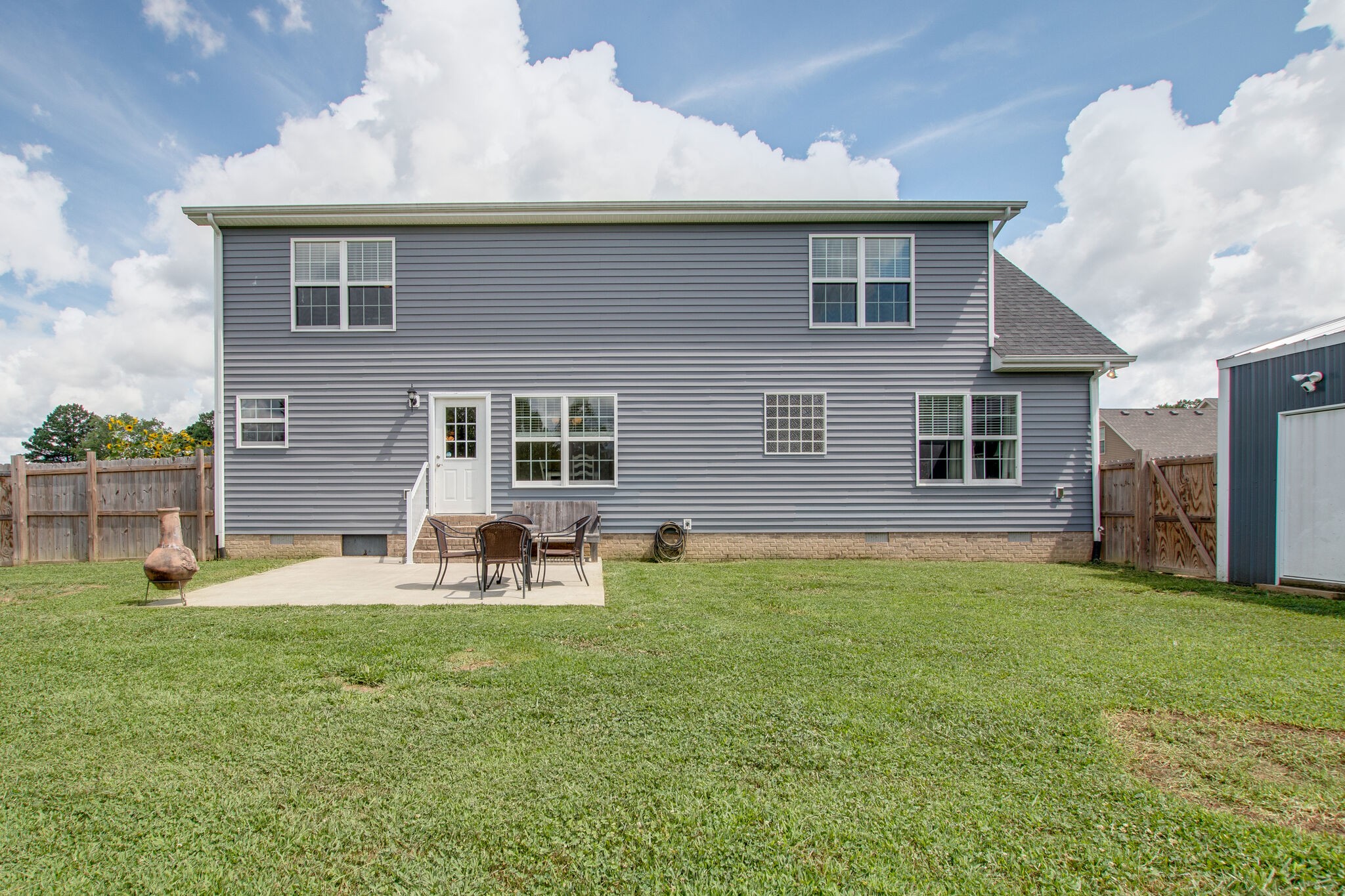 84 Houston Bell Road Manchester, TN 37355 - Photo 29 of 36 a view of a house with a yard and sitting area