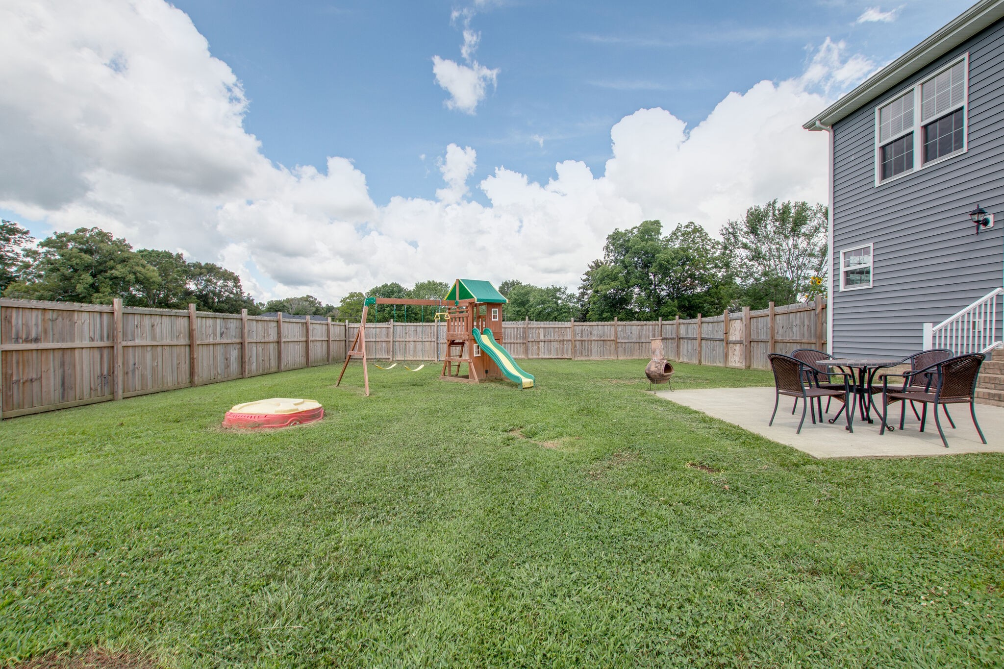 84 Houston Bell Road Manchester, TN 37355 - Photo 30 of 36 a view of a backyard with table and chairs