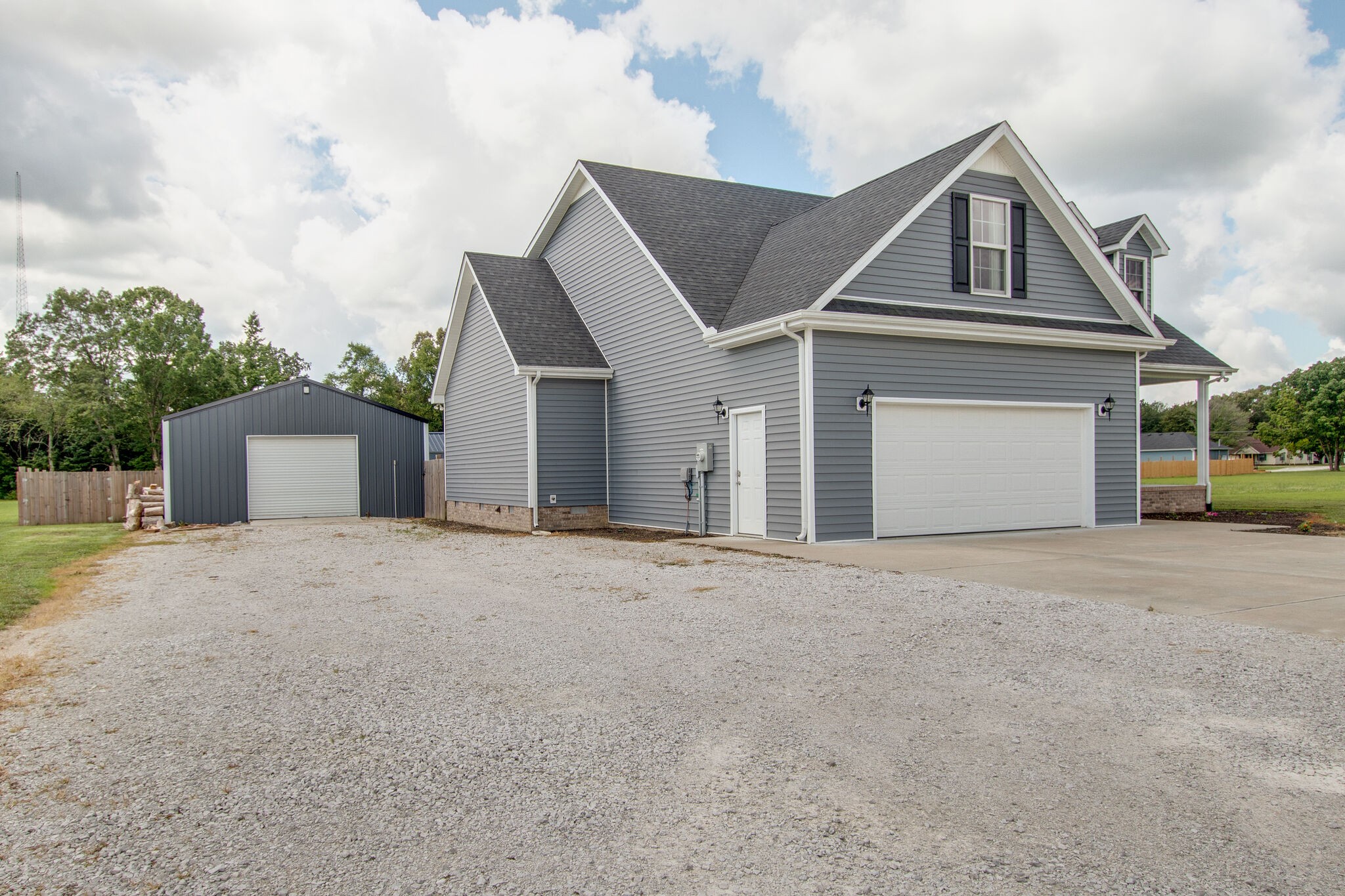 84 Houston Bell Road Manchester, TN 37355 - Photo 4 of 36 front view of a house with a yard and a garage