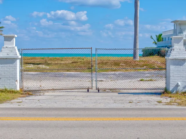 a view of a swimming pool and a yard