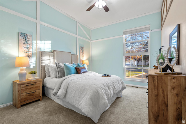 888 East 6895 South Midvale, UT 84047 - Photo 13 of 54 Spacious bedroom with vaulted ceilings, large windows, and soft natural light, creating a calm and inviting retreat.