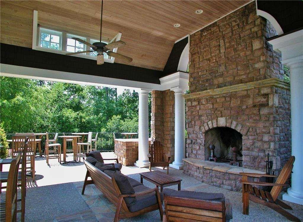 5808 Swinging Gate Road Gainesville, GA 30506 - Photo 56 of 59 a living room with patio furniture and a fireplace