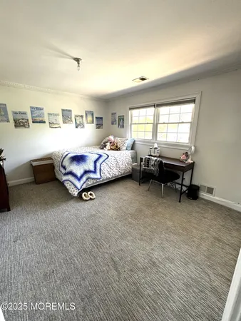 a bed room with furniture and a window