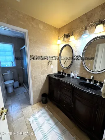 a bathroom with a toilet and a sink