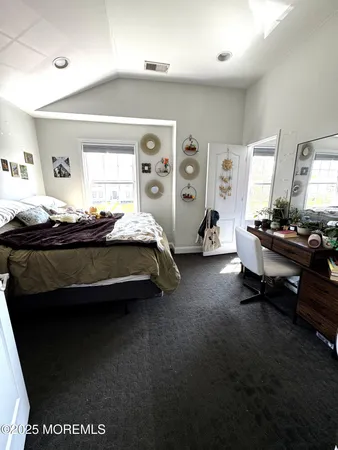 a bed room with a bed and a window