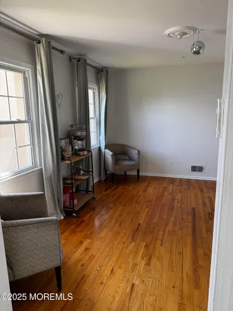 a view of room with furniture and a window