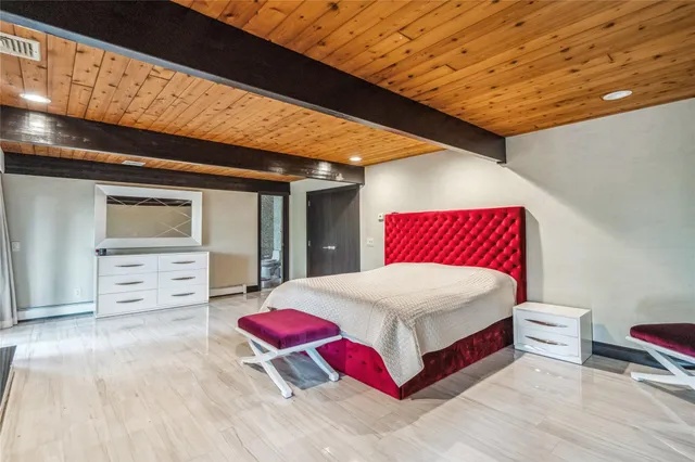a bed room with a bed and a fireplace
