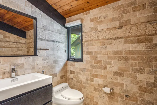 a bedroom with a bed and dresser