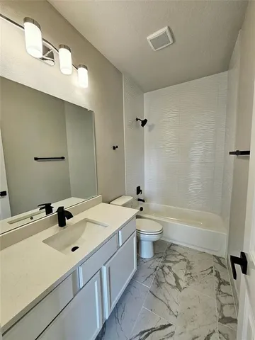 a view of a hallway with a bedroom