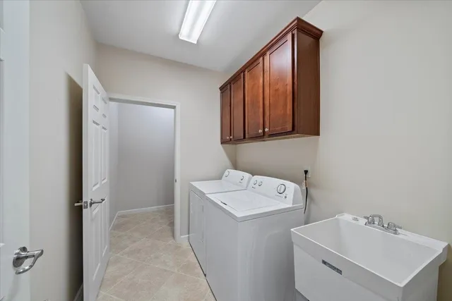 a kitchen with granite countertop a sink stove and microwave