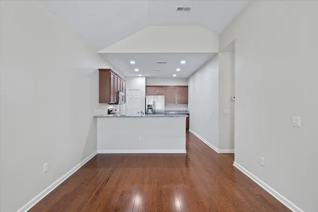 a view of kitchen with wooden floor
