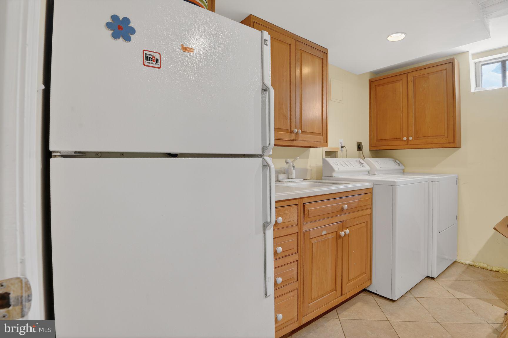 5225 Elliott Road Bethesda, MD 20816 - Photo 31 of 37 a white refrigerator freezer sitting in a kitchen