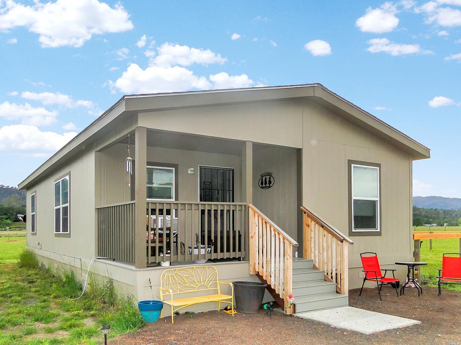 21121 Loconomi Road Middletown, CA 95461 - Photo 1 of 1 a view of a house with a porch and furniture