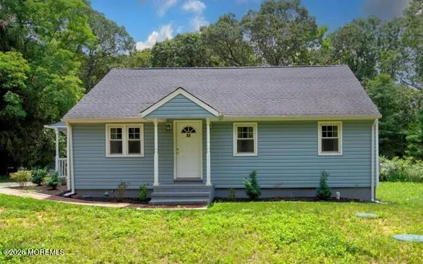 a aerial view of a house with a yard
