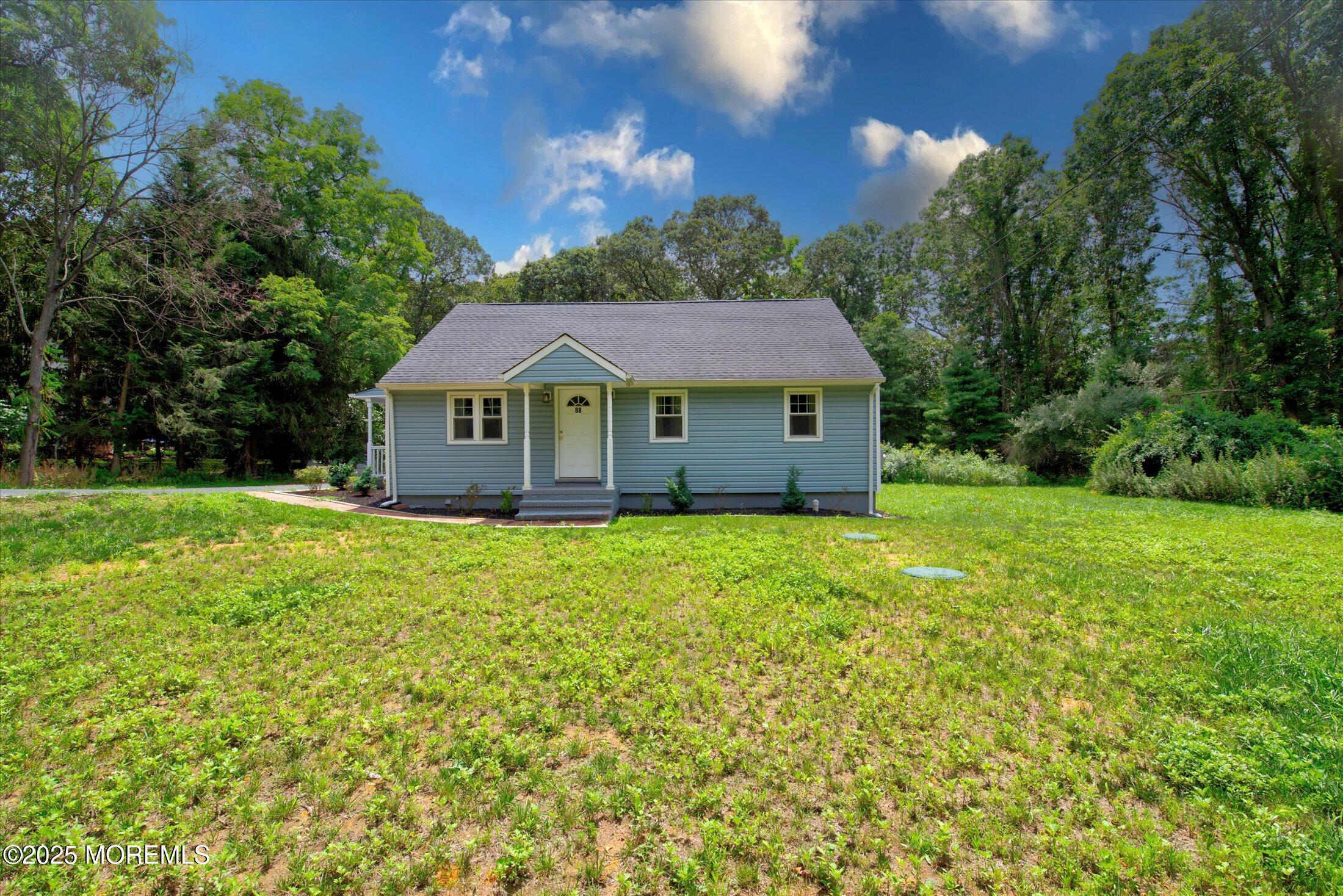 a view of a house with a backyard