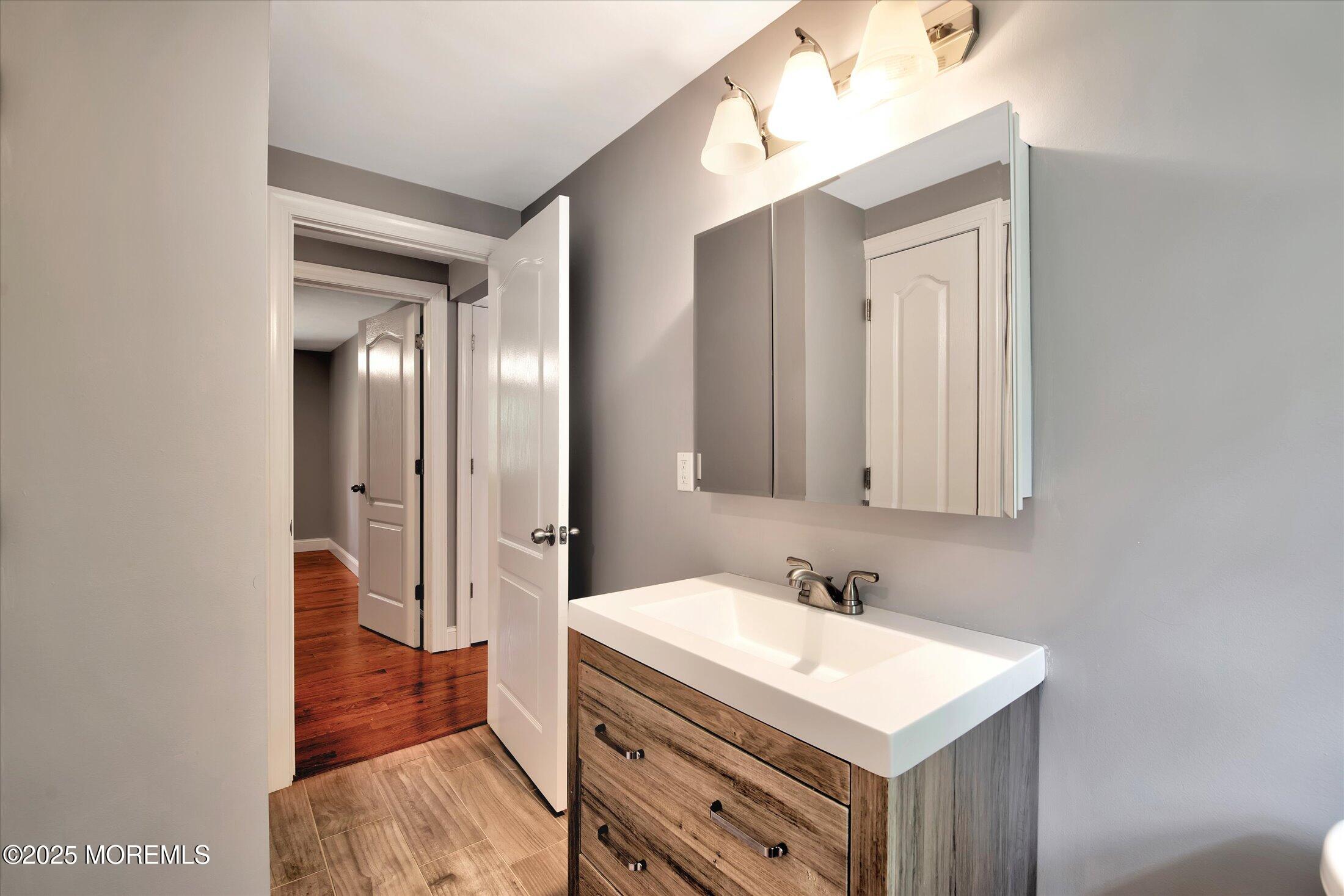 88 Dutch Lane Road Marlboro, NJ 07746 - Photo 24 of 35 a bathroom with a sink a toilet and shower