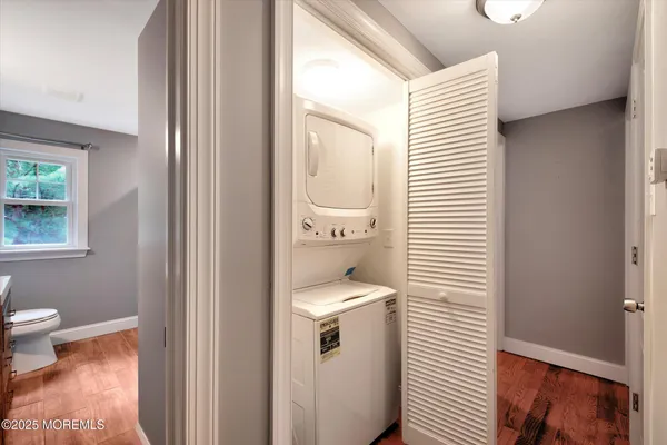 a kitchen with a refrigerator and a stove top oven