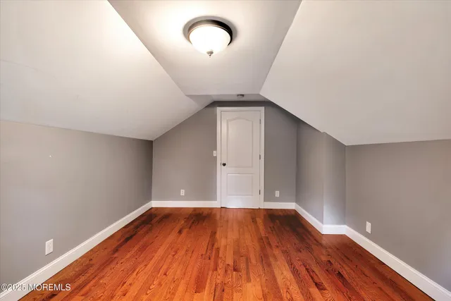 a view of room with wooden floor