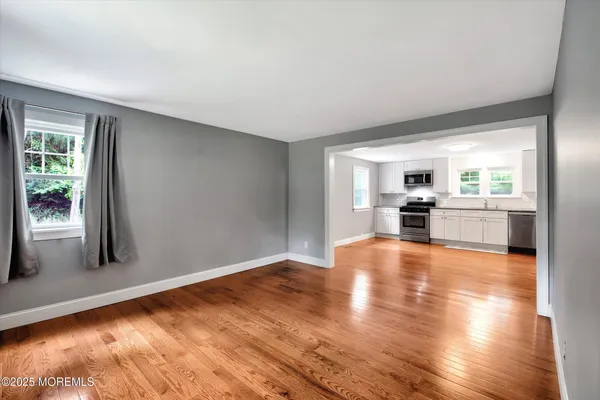 a kitchen with a white cabinets and stainless steel appliances