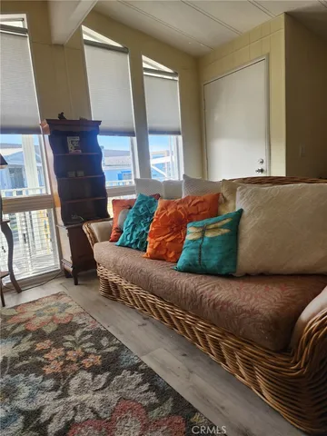 a living room with a couch and a window