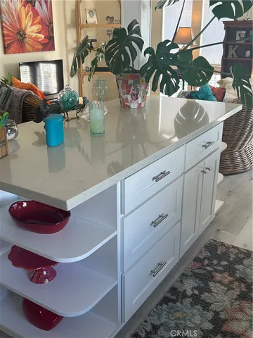 a view of a vase with flowers on a table