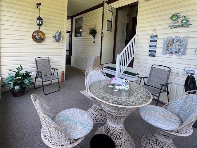 605 Michigan Boulevard, Unit 100 Dunedin, FL 34698 - Photo 4 of 20 a living room with furniture and a fireplace