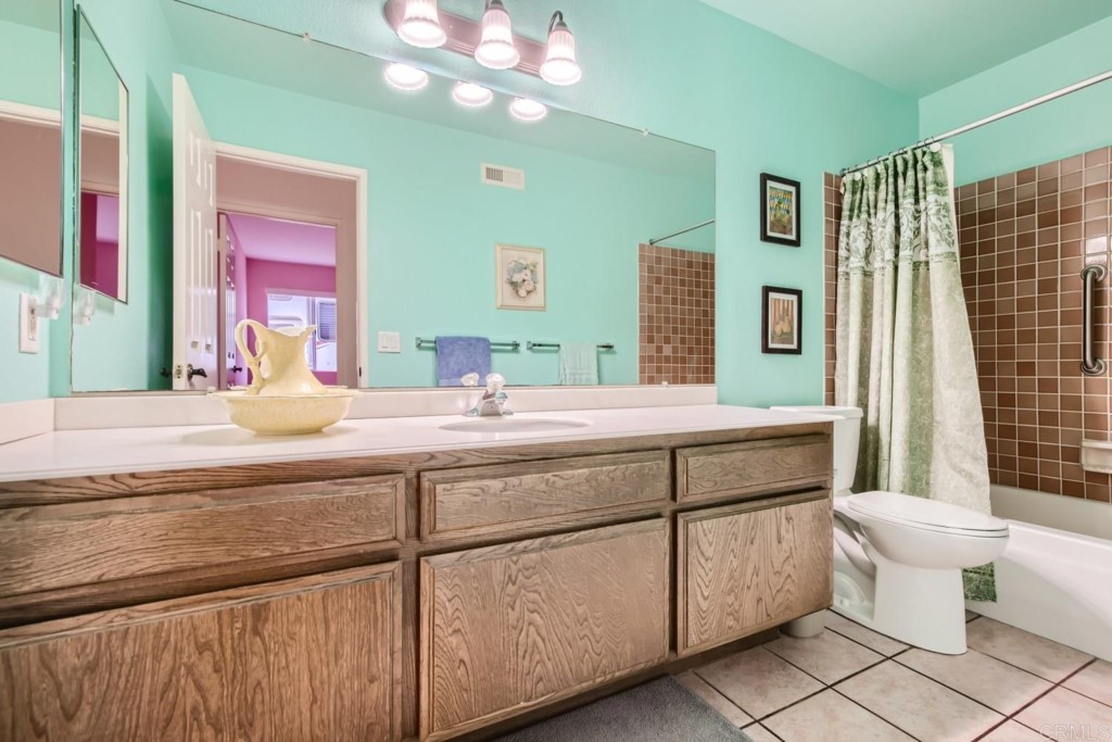 404 Compass Road Oceanside, CA 92054 - Photo 16 of 26 a bathroom with a double vanity sink mirror and toilet