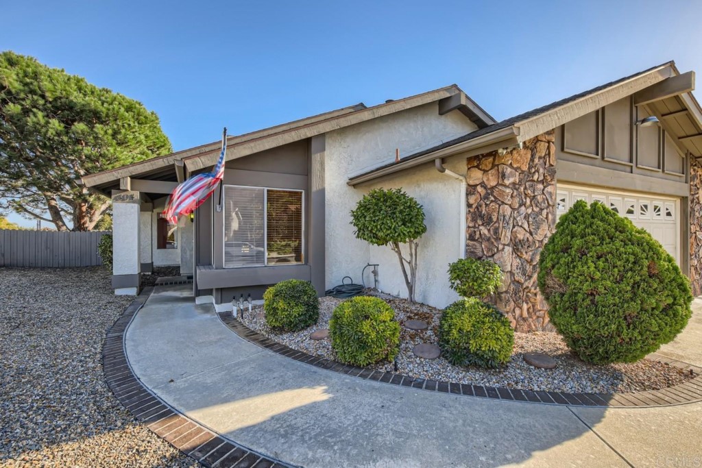 404 Compass Road Oceanside, CA 92054 - Photo 2 of 26 a front view of a house with garden