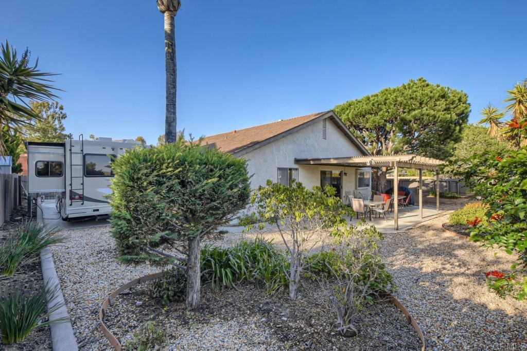 404 Compass Road Oceanside, CA 92054 - Photo 21 of 26 a front view of a house with garden