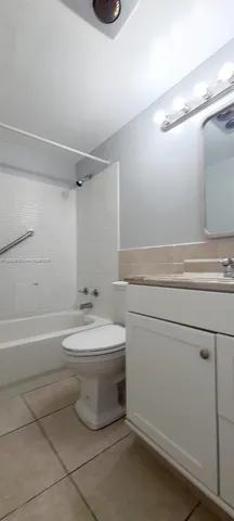 a bathroom with a toilet a sink and bathtub