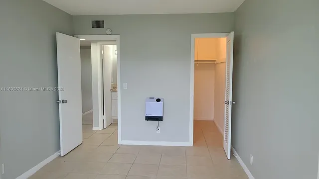 a view of room with window and hardwood floor