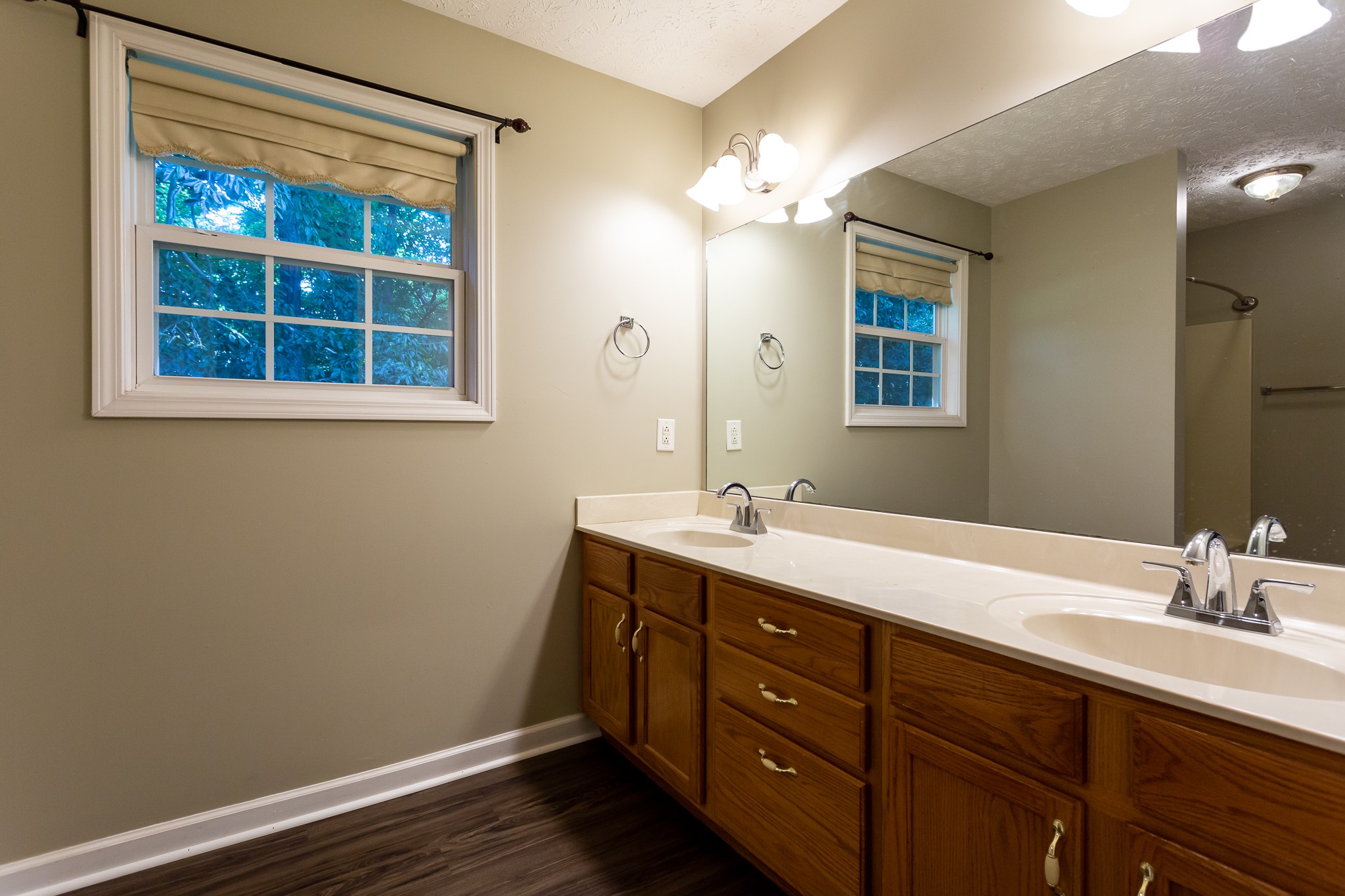 1649 Gratton Road Clarksville, TN 37043 - Photo 12 of 23 a bathroom with a double vanity sink and a mirror