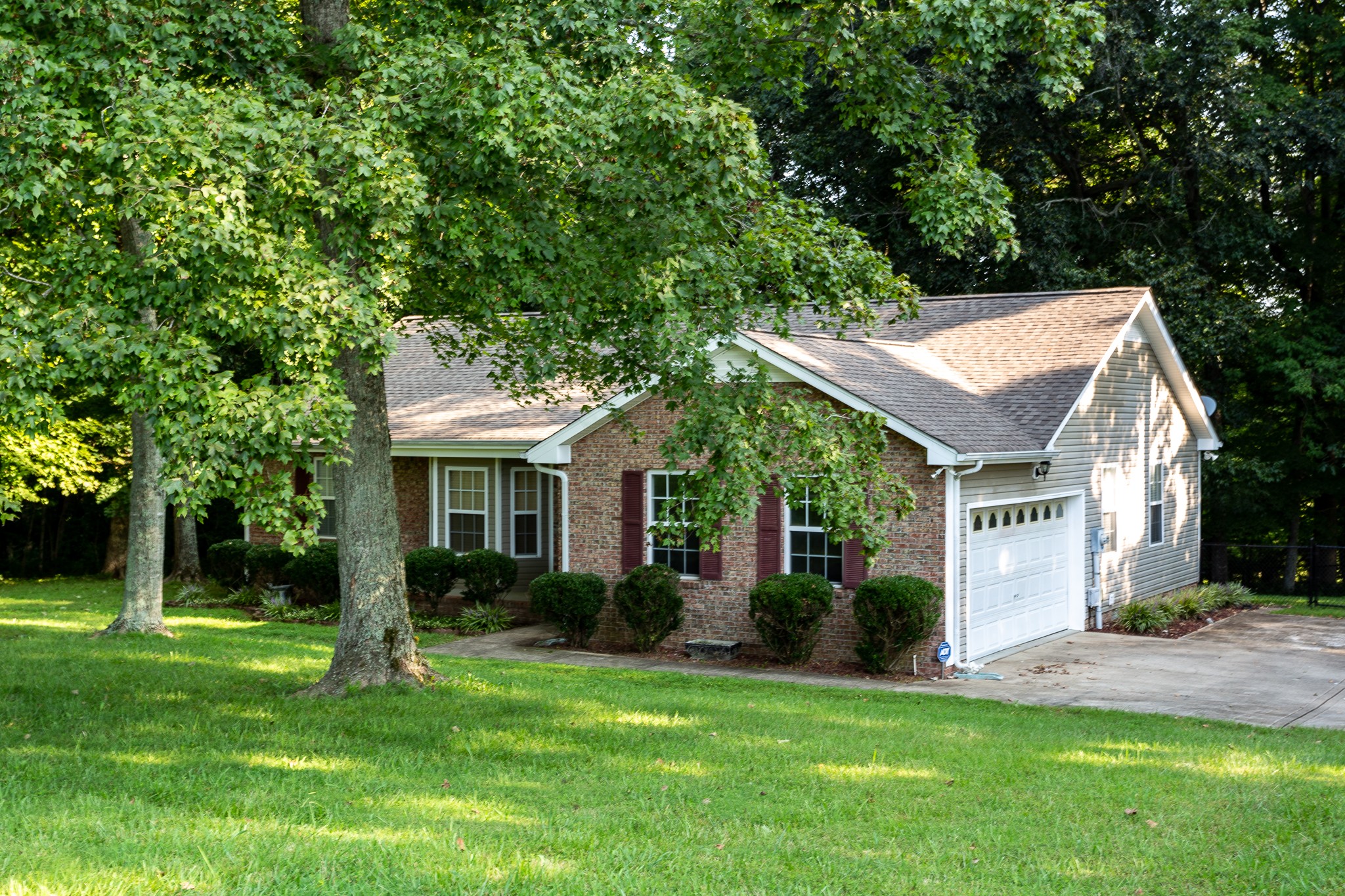 1649 Gratton Road Clarksville, TN 37043 - Photo 17 of 23 a view of a house with a big yard plants and large trees