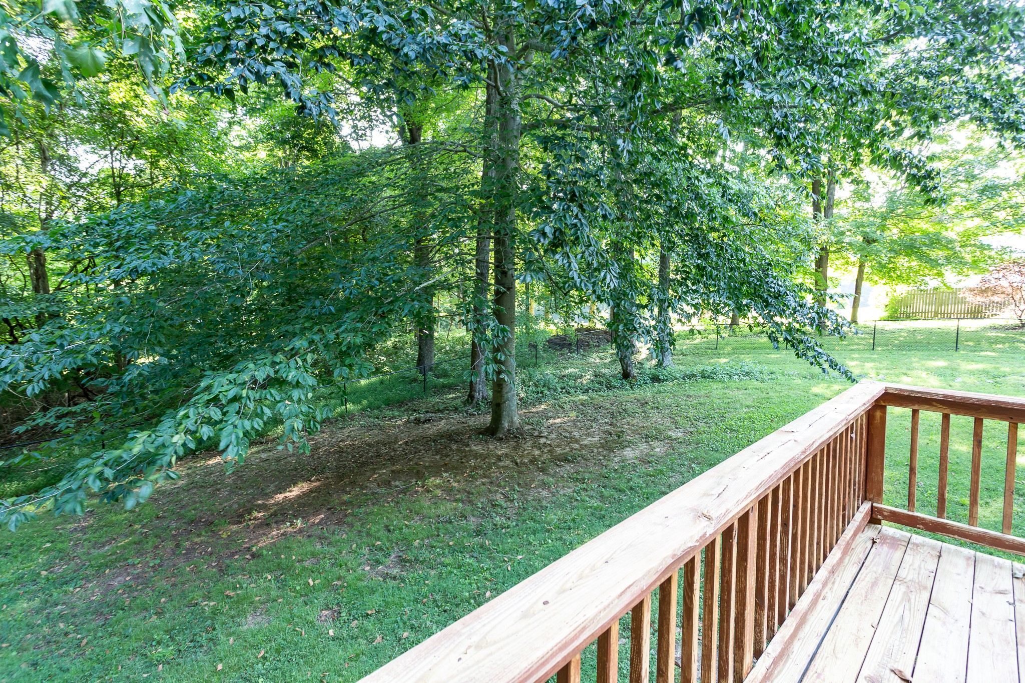 1649 Gratton Road Clarksville, TN 37043 - Photo 21 of 23 a view of a wooden deck with a yard