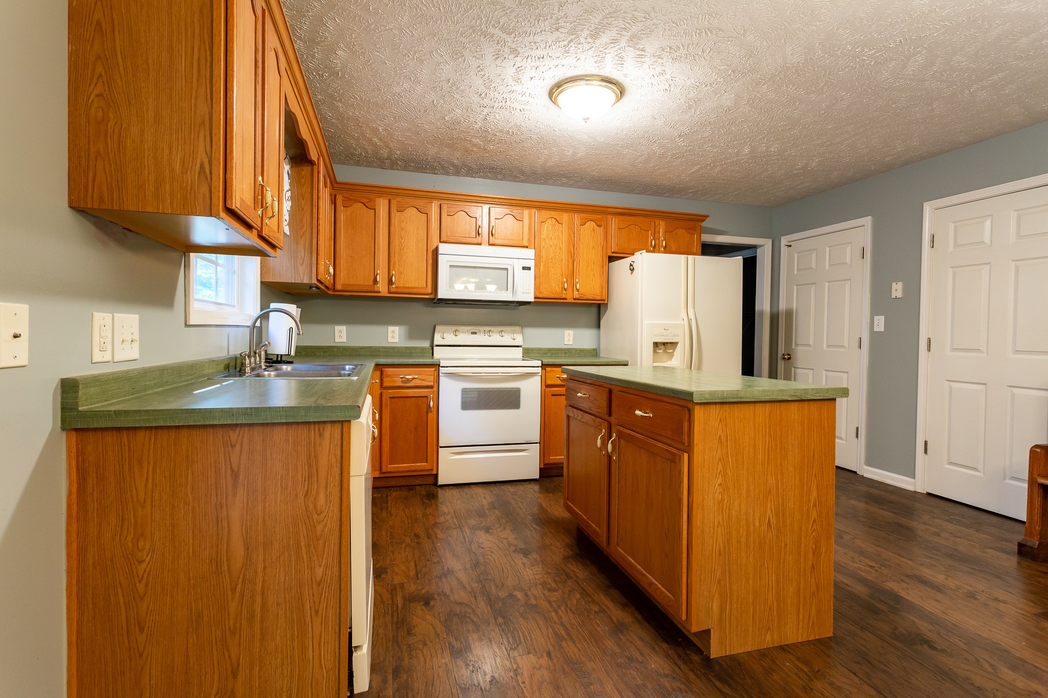 1649 Gratton Road Clarksville, TN 37043 - Photo 5 of 23 a kitchen with stainless steel appliances granite countertop a stove a sink dishwasher and a refrigerator