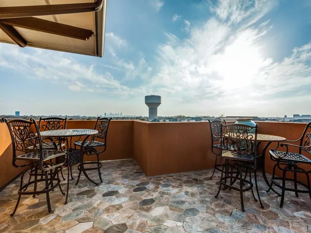 a view of a terrace with dining table and chair