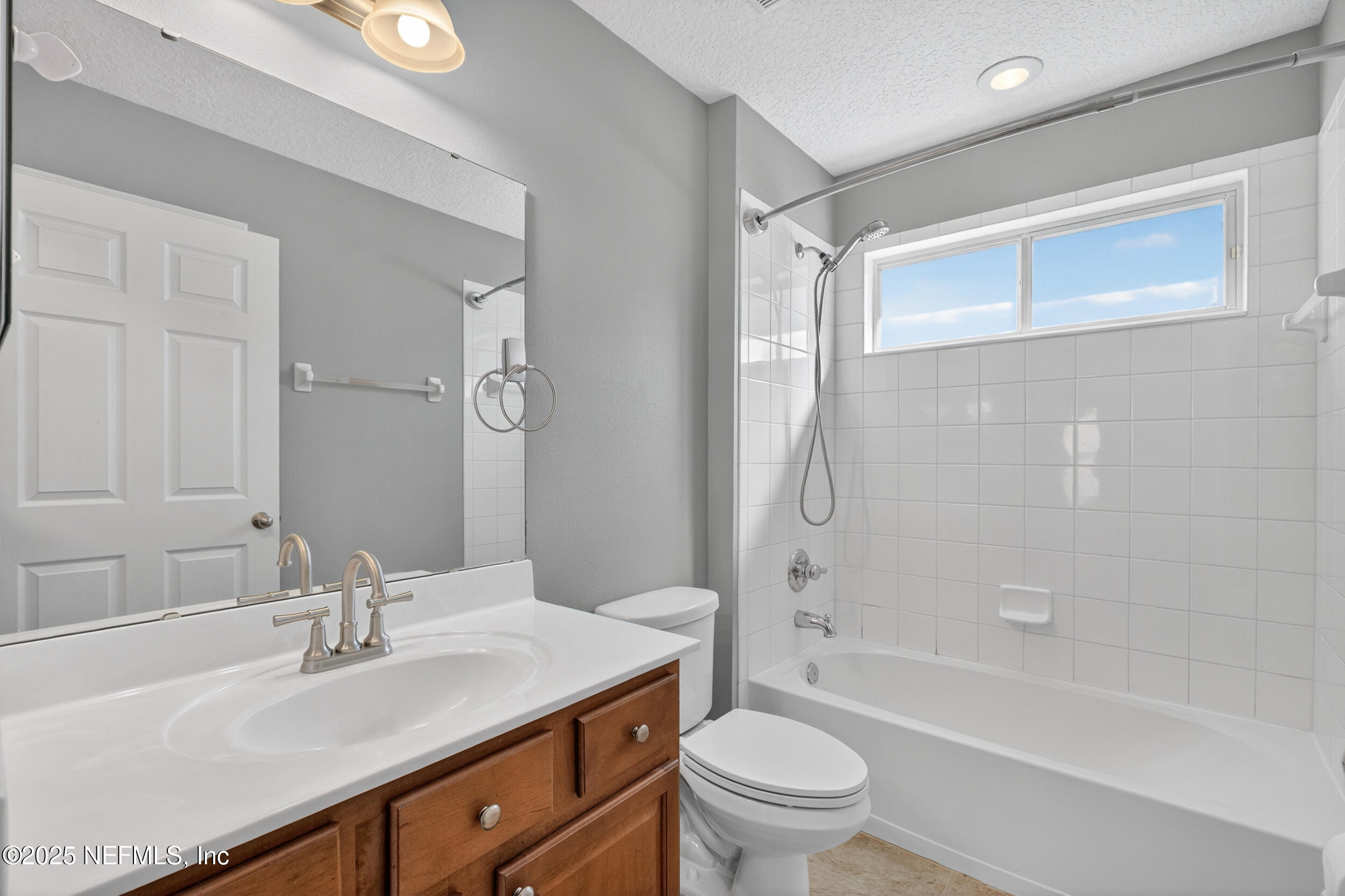 1165 Carmona Place St. Augustine, FL 32092 - Photo 11 of 31 a bathroom with a sink a toilet and shower