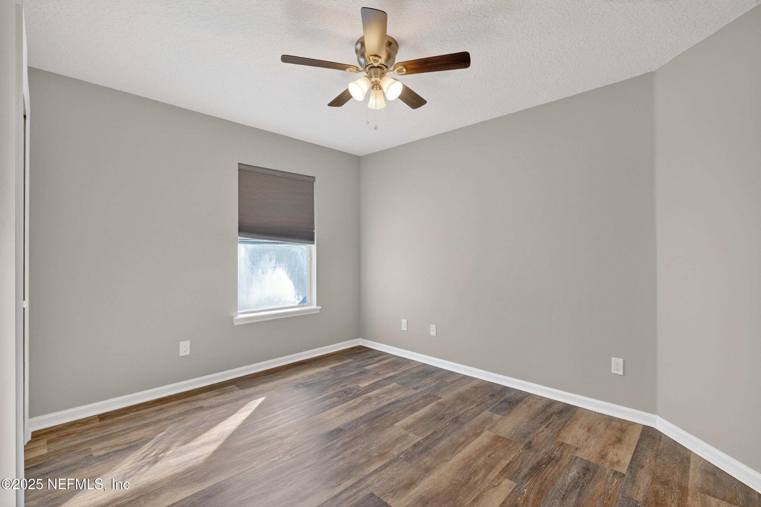 1165 Carmona Place St. Augustine, FL 32092 - Photo 12 of 31 wooden floor in an empty room with a window