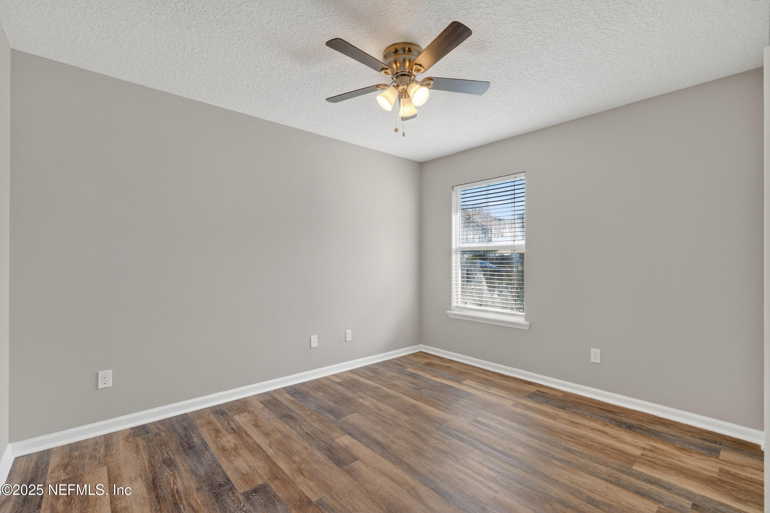 1165 Carmona Place St. Augustine, FL 32092 - Photo 13 of 31 wooden floor in an empty room with a window