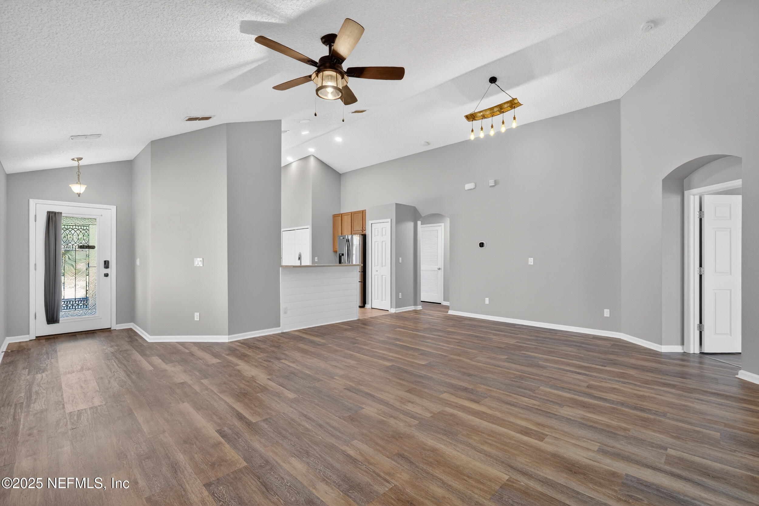 1165 Carmona Place St. Augustine, FL 32092 - Photo 19 of 31 a view of an empty room with a window and wooden floor