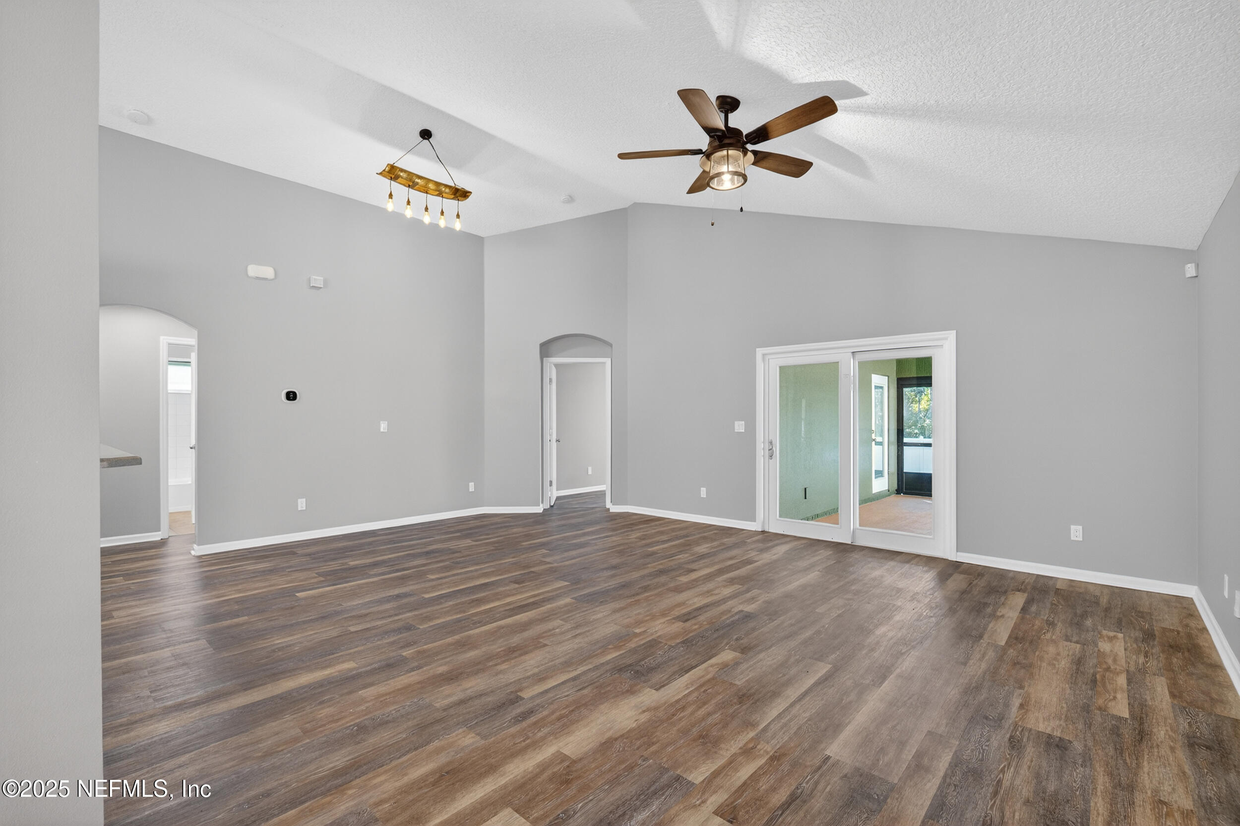 1165 Carmona Place St. Augustine, FL 32092 - Photo 21 of 31 a view of empty room with wooden floor and ceiling fan