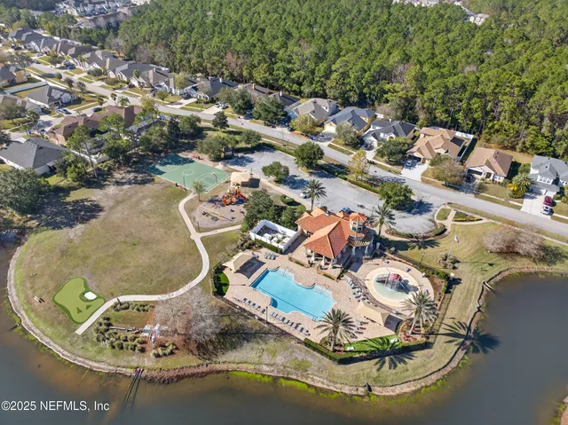 an aerial view of a house with outdoor space