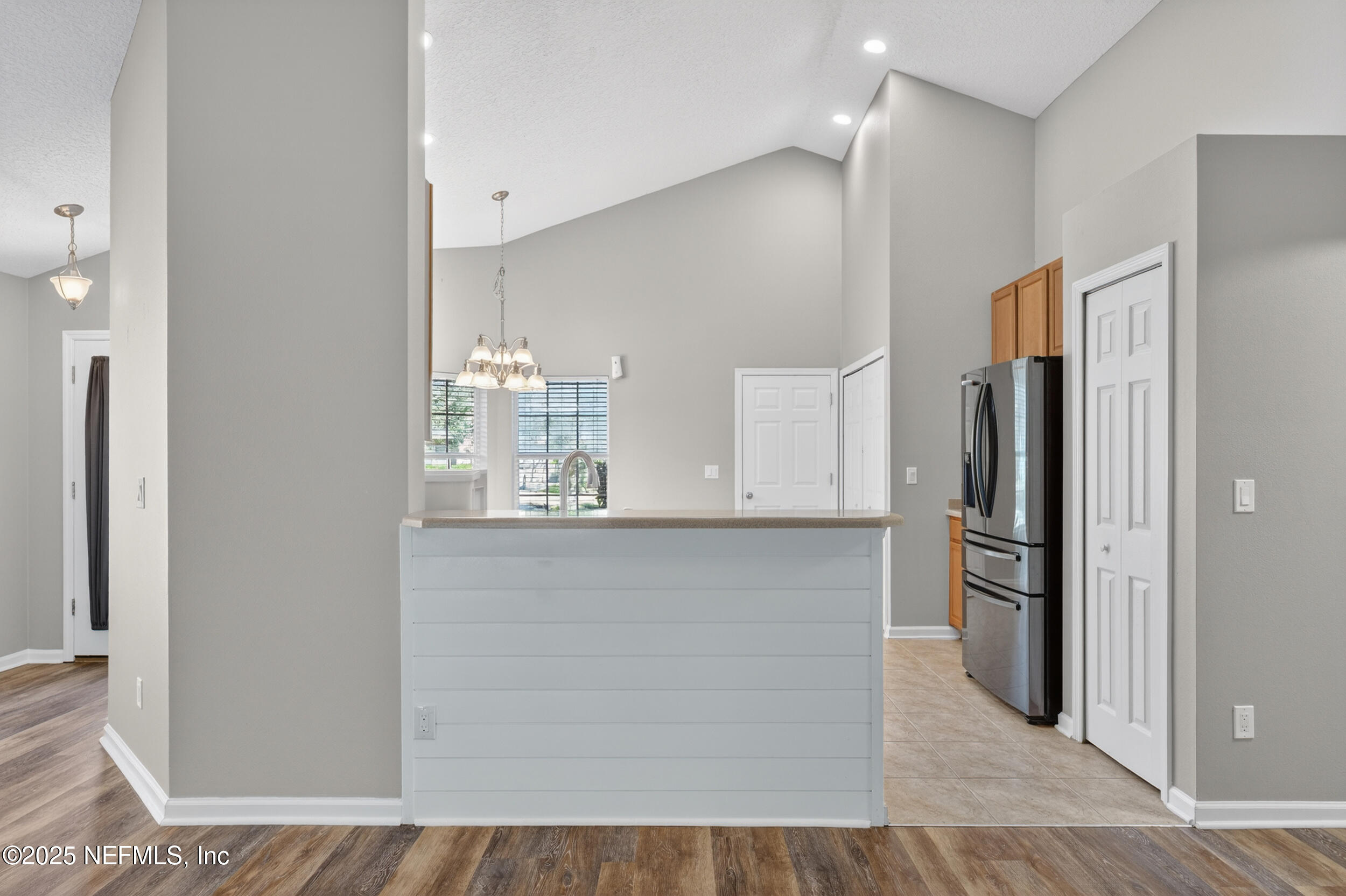 1165 Carmona Place St. Augustine, FL 32092 - Photo 9 of 31 a kitchen with stainless steel appliances a refrigerator and microwave