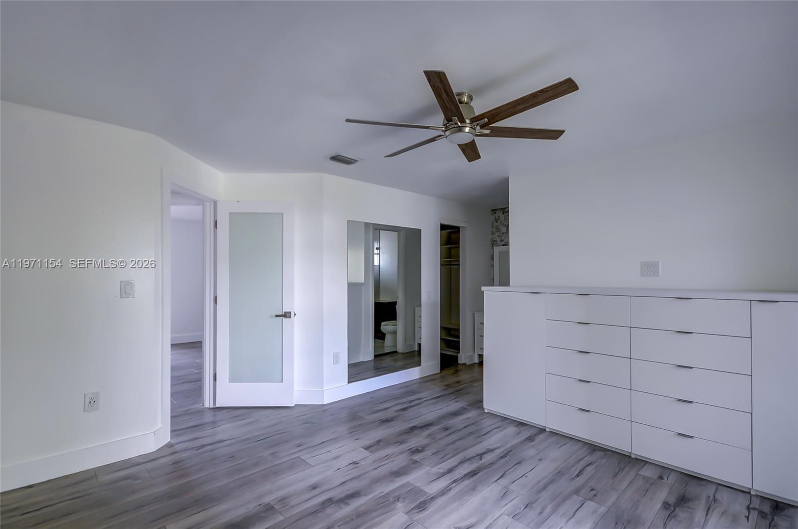 12909 Southwest 61st Terrace Miami, FL 33183 - Photo 23 of 36 a view of a livingroom with wooden floors