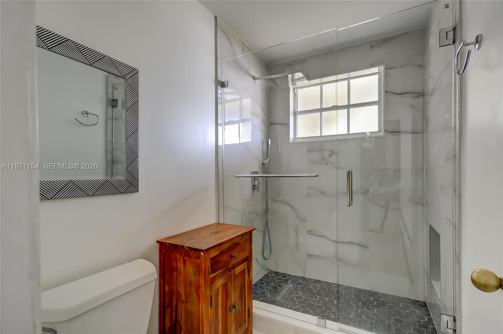 12909 Southwest 61st Terrace Miami, FL 33183 - Photo 25 of 36 a bathroom with a shower and toilet