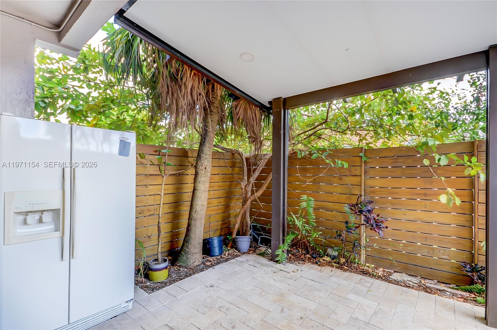 12909 Southwest 61st Terrace Miami, FL 33183 - Photo 3 of 36 a room with a large window