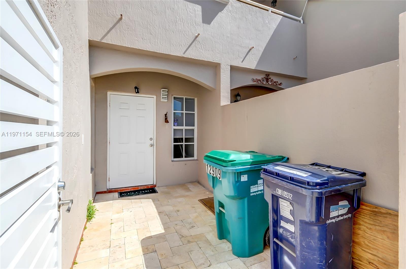 12909 Southwest 61st Terrace Miami, FL 33183 - Photo 33 of 36 a view of an entryway with window