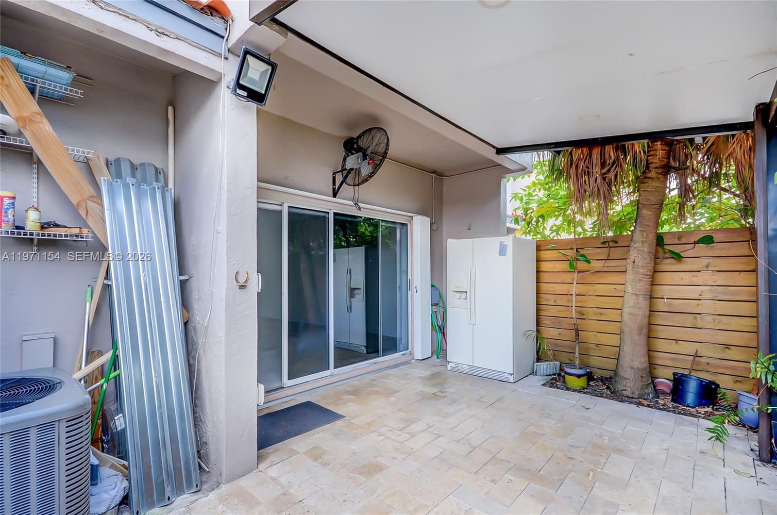 12909 Southwest 61st Terrace Miami, FL 33183 - Photo 6 of 36 a view of a porch with wooden floor and stairs